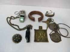 Box of collectable items including a brass icon, silver brooch & a manila