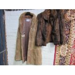 Light brown long fur gillet & a dark brown fur jacket. Estimate £20-30.