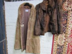 Light brown long fur gillet & a dark brown fur jacket. Estimate £20-30.