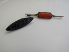 Bakelite brooch & a silver Carmelian bar brooch. Estimate £15-25.