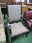 Ebonised open armchair. Estimate £25-35.