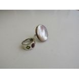 Silver & red stone ring & a silver fashion ring. Estimate £10-20.