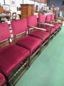 4 + 2 oak framed red upholstered chairs with bobbin turned stretcher to fronts. Estimate £40-60.