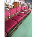 4 + 2 oak framed red upholstered chairs with bobbin turned stretcher to fronts. Estimate £40-60.