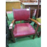 Low leather effect open armchair. Estimate £10-20.