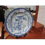 19th century blue & white oriental style plate, 43cms diameter (has been repaired). Estimate £30-
