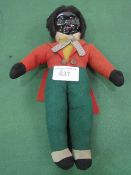 Black doll with celluloid face & opening/closing eyes. Estimate £40-50.