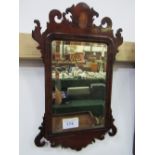 Small Chippendale style mahogany wall mirror with inlaid shell motif, bevelled glass. Estimate £30-