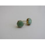 Pair of jade & gold metal earrings. Estimate £70-90.