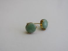 Pair of jade & gold metal earrings. Estimate £70-90.