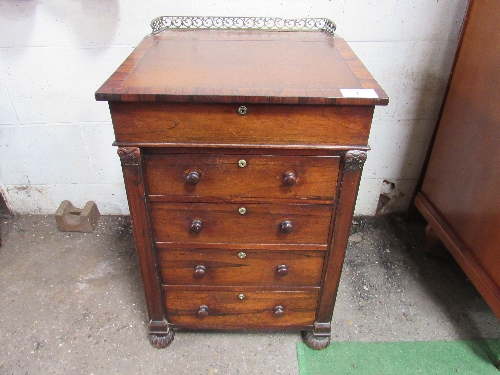 Rosewood Davenport on bung feet with fretted rail to back, side drawer including 2 inkwells, 54cms x