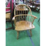 Elm open armchair. Estimate £60-80.