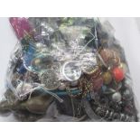 A bag of costume jewellery. Estimate £10-15.