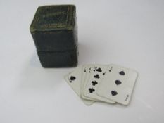 Green leather Victorian box complete with 2 sets of miniature playing cards. Estimate £30-40.