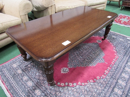 Mahogany coffee table with 3 frieze drawers, reeded legs to castors, 136cms x 68cms x 46cms.