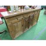 Oak sideboard with carved door, 3 frieze drawers over 3 cupboards, 160cms x 39cms x 86cms.