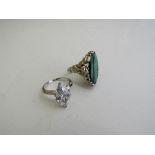 Silver & green stone ring & a silver oval white stone ring. Estimate £10-20.