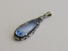 Vintage white metal & blue tear drop stone pendant, length of pendant 4.25mm. Estimate £30-50.