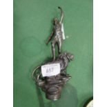 Metal statuette of a person standing on a lion. Estimate £10-20.