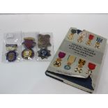 3 sterling silver Masonic medals together with a book on European Orders, medals & decorations.