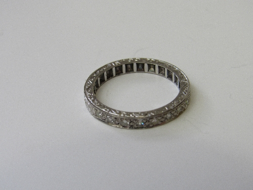 18ct white gold eternity ring, 1/2 set with diamonds, size P, weight 4.9gms. Estimate £350-400.