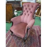Victorian pink upholstered carved nursing chair on castors. Estimate £30-60.