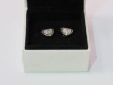 Exclusive Michael Kors heart earrings (in Pandora box). Estimate £20-30.