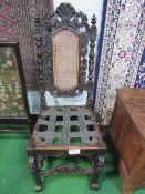 Victorian oak framed hall chair with cane panel. Estimate £20-40.