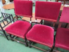 Pair of red upholstered oak framed hall chairs. Estimate £20-30.