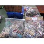 A large collection of costume jewellery: 3 bags & 2 boxes. Estimate £10-20.