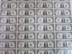 Framed & glazed sheet of 32 USA one dollar bills. Estimate £140-160.