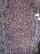 Persian rug with geometric patter, 1.6m x 0.96cms. Estimate £20-30.
