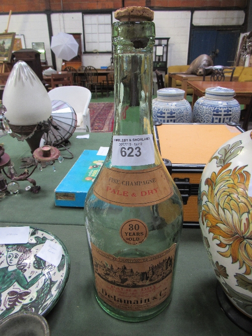 Large antique Delamain & Co cognac bottle with its original label. Estimate £25-40.