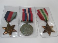 3 WWII medals: Italy Star, The 1939-1945 Star & Service Medal. Estimate £20-30.