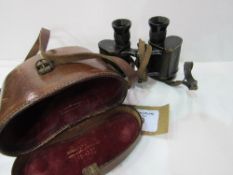 A pair of Ross WWI binoculars in original leather case with WD mark. Estimate £20-40.