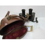 A pair of Ross WWI binoculars in original leather case with WD mark. Estimate £20-40.