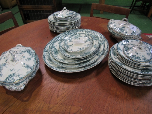 Qty of green, white & gold Staffordshire dinner ware. Estimate £30-40.