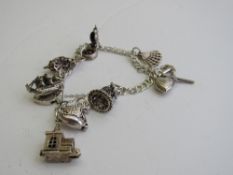 925 hallmarked antique silver bracelet & some antique metal charms (some marked) weight 0.6ozt.