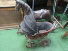 Reproduction Victorian child's pram together with a small rocking horse. Estimate £20-30