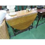 Oak gate-leg table on barley twist legs, 135cms (open) x 92cms. Estimate £20-40