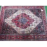 Persian deep red ground rug, 150cms x 115cms. Estimate £20-40