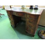 Mahogany serpentine front knee-hole desk with leather skiver, 105cms x 53cms x 76cms. Estimate £80-
