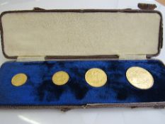 A case containing a set of 4 Queen Victoria Golden Jubilee Sovereigns, 1887: half sovereign;