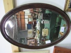 Oak framed oval bevel edge mirror, 72cms x 48cms. Estimate £10-20