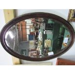 Oak framed oval bevel edge mirror, 72cms x 48cms. Estimate £10-20