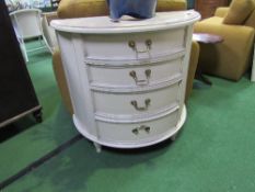 Cream coloured demi-lune 4 drawer cabinet, 84cms (maximum) x 43cms x 78cms. Estimate £30-50.