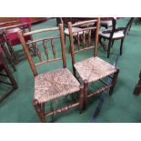 2 oak framed ladder back dining chairs with string seats. Estimate £10-20