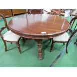 Victorian mahogany circular tilt-top table on heavy turned column to 3 shaped feet to casters,