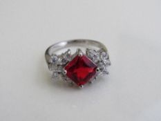 Sterling silver ring with synthetic ruby stone, size P 1/2. Estimate £15-25