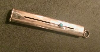 9ct gold pencil holder/slider set with a single turquoise cabochon. Estimate £85-100